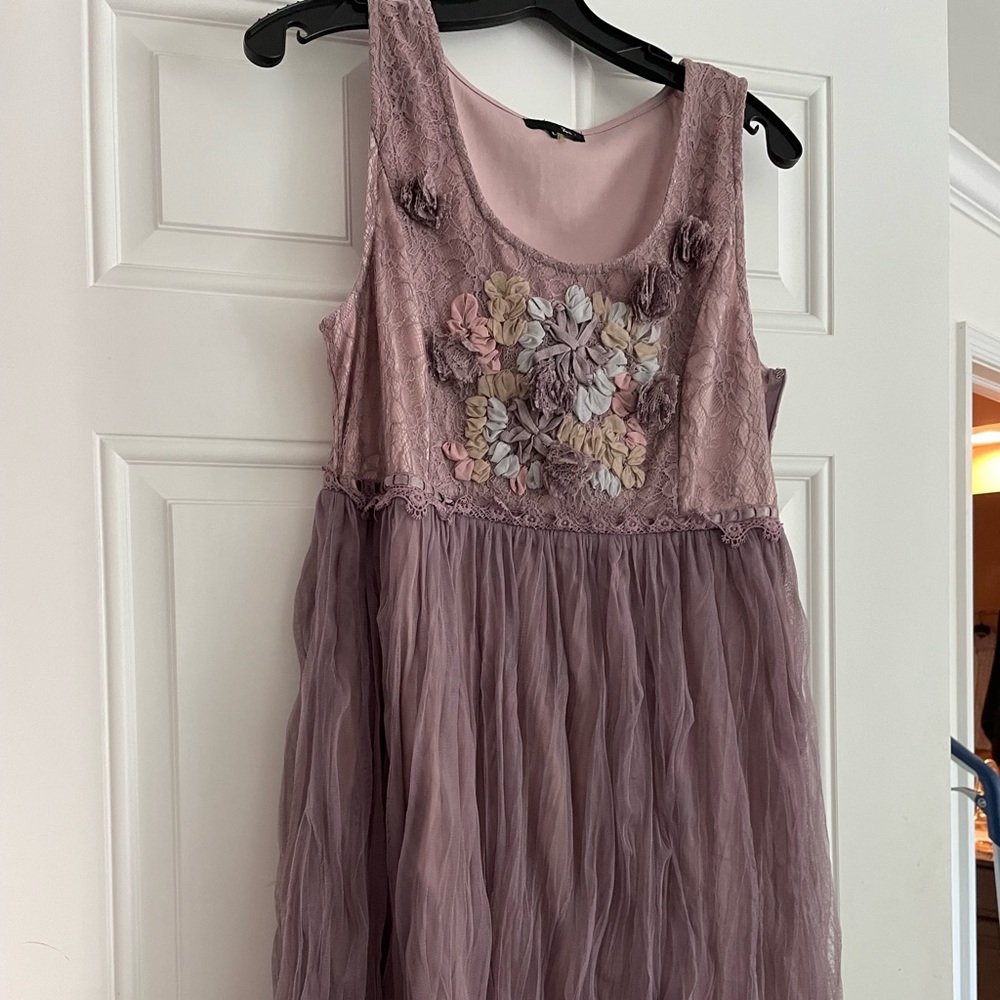 Mauve colored empire tulle dress with blue, green, lavender flowers.